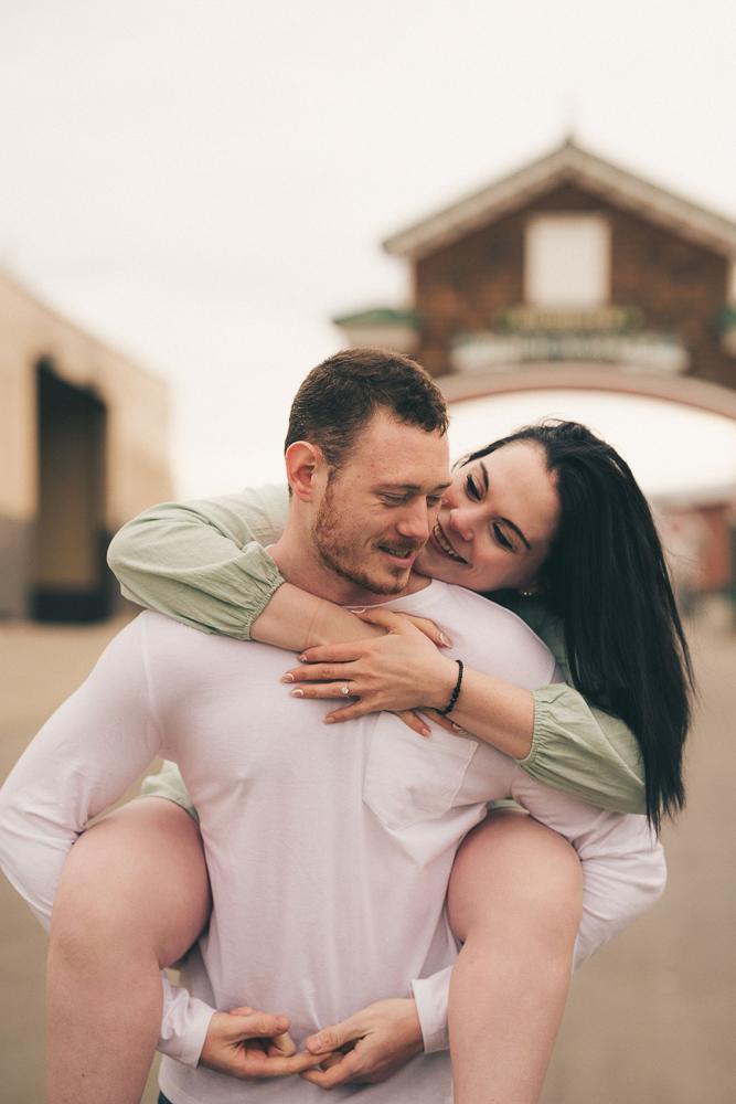 Felicia & Alex - Engagement in Rochester Public Market featuring donuts from Box Car Donut