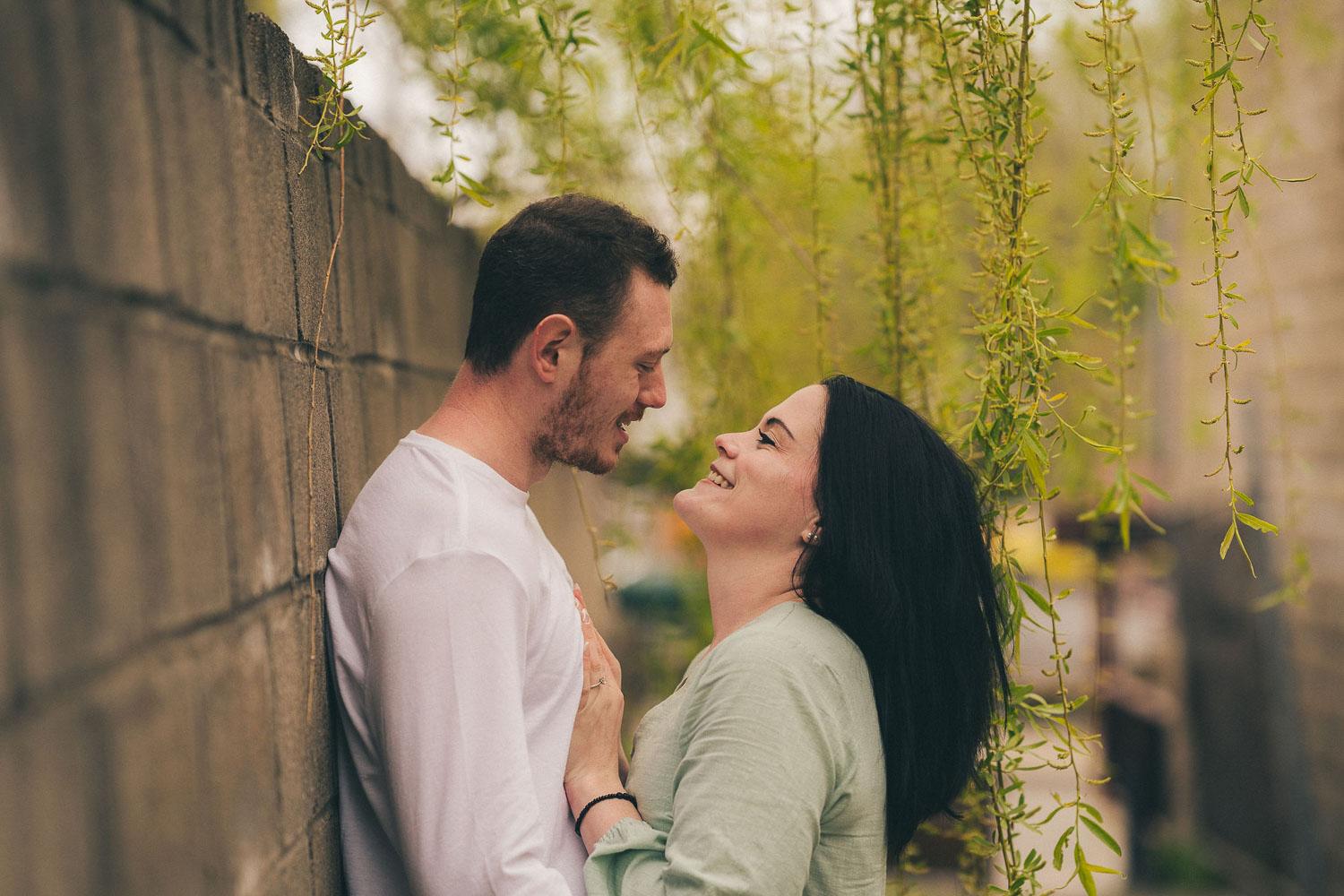 Felicia & Alex - Engagement in Rochester Public Market featuring donuts from Box Car Donut